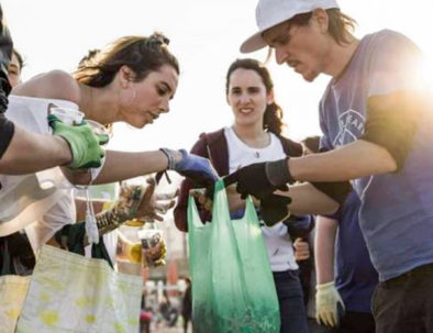 Beach cleaning team building activity in Sitges